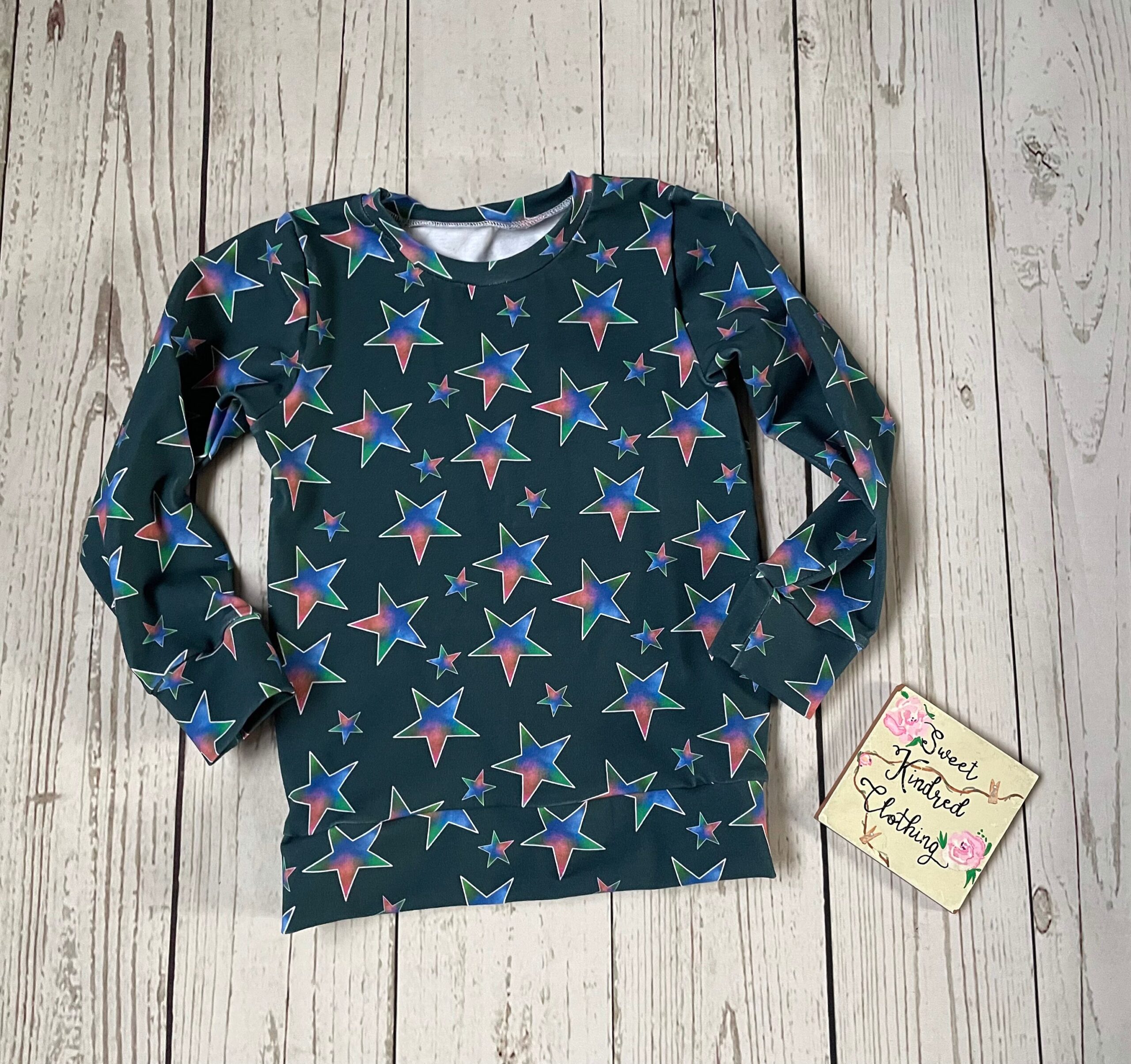 Star jumper, handmade children’s jumper, blue, pink and green stars